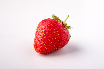 One strawberry isolated on white background