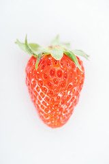 top view of fresh whole ripe red strawberry on white background