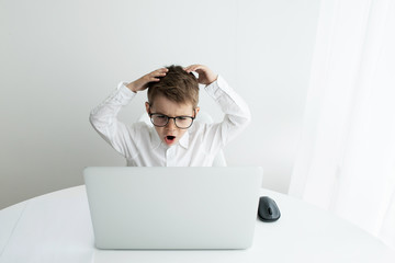 Young businessman working with laptop at office