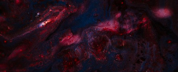 Abstract red blue mix paint background. Acrylic texture space universe like pattern. Glittering sparkling liquid surface motif.