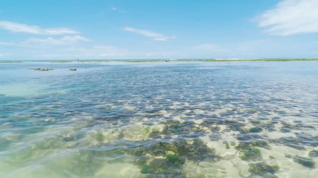 View of the sea and the corals underwater in the middle of the sea at Caribessa - Bessa beach (Praia do Bessa). Tourist destination of Joao Pessoa PB, Brazil. Low tide 