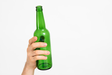 Ecology concept. Garbage sorting and recycling. Zero waste lifestyle. Glass bottle in man hand. Copy space.