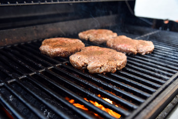 Grilling burgers on a barbecue