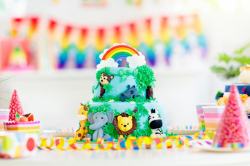 Kids birthday cake. Child jungle theme party.