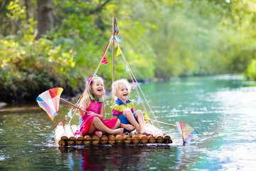 Kids on wooden raft