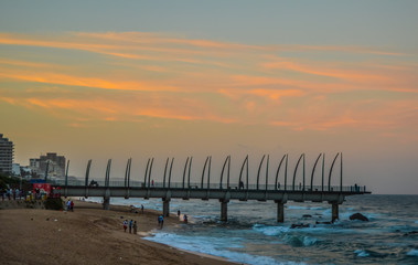 Naklejka na ściany i meble Beautiful Umhlanga Promenade Pier a whalebone made pier in Kwazulu Natal Durban North South Africa during sunset
