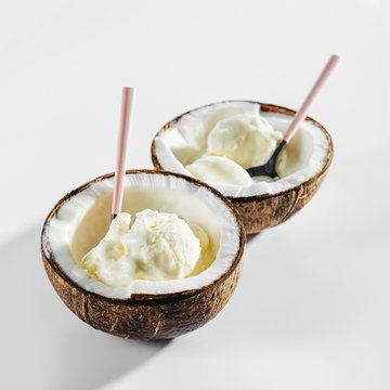 Balls of coco ice cream in half of coconut. Healthy concept, lactose free ice cream.