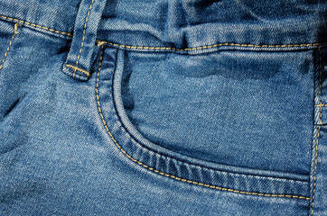 Light blue jeans front pocket detail background