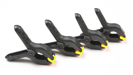 Obraz premium four black pegs on a white background. work items