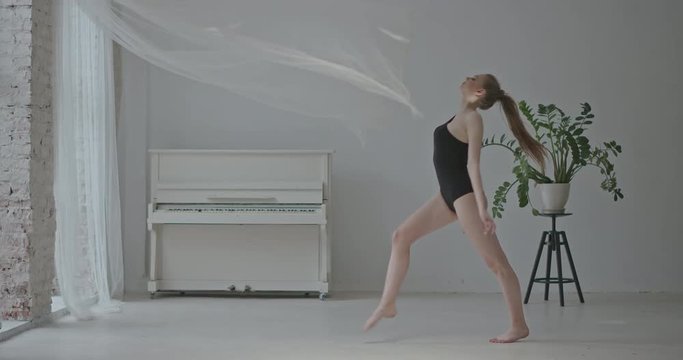 Graceful young woman dancer using filmy textile. RAW video record.