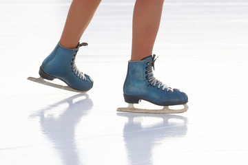 feet skating girl skating on ice rink.. Hobbies and recreation. Sports and holidays