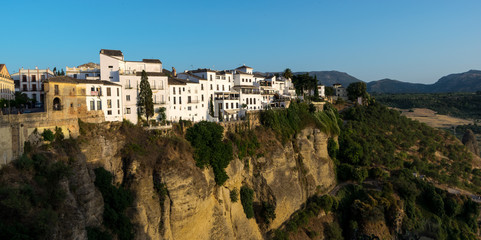 Obraz premium The white houses near the El Tago Gorge from the Andalusian Spainish town of Ronda