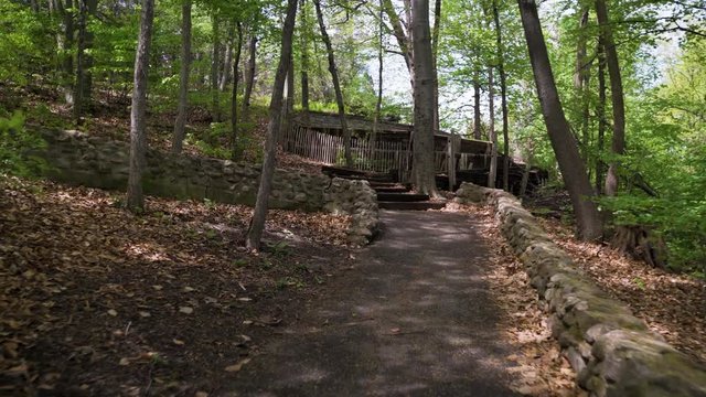 Hiking path with wooden steps and stonewalls located in Ontario, Canada