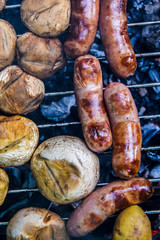 barbecue on the nature in summer mushrooms meat sausages kebab grilled over charcoal