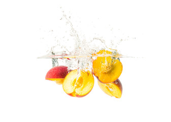 Fresh Nectarine with water splash over white background