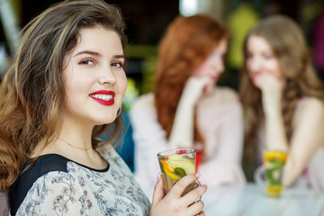 Adult women gossip behind the back of a friend. The concept of lifestyle, gossip, lies, friendship