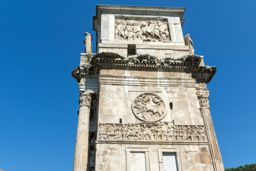 Ancient Arch of Constantine near Colosseum in city of Rome, Italy