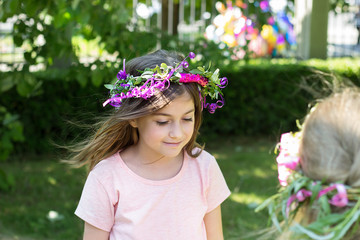 Little girl with wreath of flowers on her head, celebrating Lazarus saturday