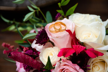 Wedding ring on flowers.