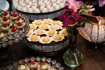 Obraz na płótnie Canvas Sweet table at wedding party. Various sweets.
