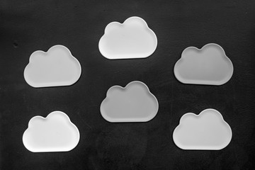cloud computing concept with clouds on black background top view