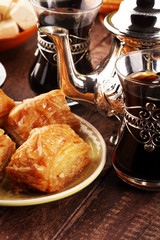 Middle eastern or arabic dishes and assorted meze, concrete rustic background. Turkish Bread or Turkish pizza. Dessert Baklava with pistachio. falafel with hommos.  Halal food. Lebanese cuisine