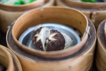 Closeup of Dim Sum in bamboo steamer, Chinese cuisine.