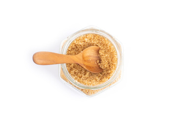 Brown sugar  in a glass jar isolated on white background, Top view