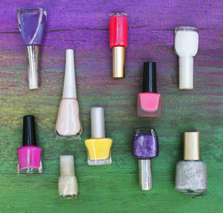 Assorted nail polishes on wooden background - 270119807