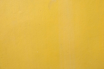 yellow cement wall background close up