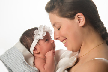 closeup of mother with her newborn baby isolated on white background