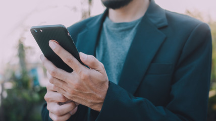 Cropped Hands Holding Mobile Smart Phone,Business And Technology Concept