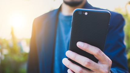 Cropped Hands Holding Mobile Smart Phone,Business And Technology Concept
