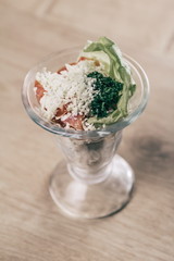 cocktail salad with fresh vegetables and Suluguni cheese