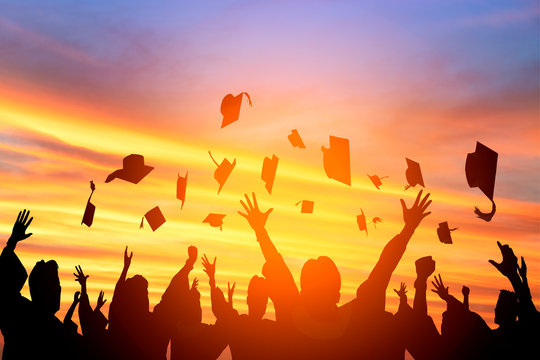 graduation hats in the air