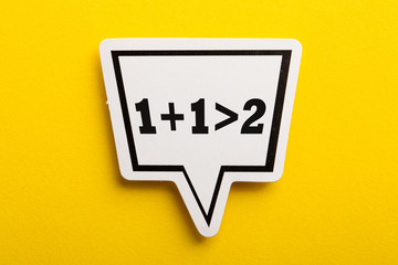 Synergy 1+1>2 Speech Bubble Isolated On Yellow Background