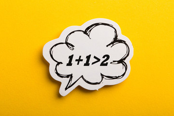 Synergy 1+1>2 Speech Bubble Isolated On Yellow Background