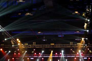 Performance moving lighting on construction light beam ray downward in yellow blue color, on Concert and Fashion Show stage ramp. LED par new technology to save power more color and high density Light