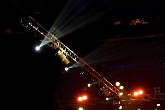Performance moving lighting on construction light beam ray downward in yellow blue color, on Concert and Fashion Show stage ramp. LED par new technology to save power more color and high density Light