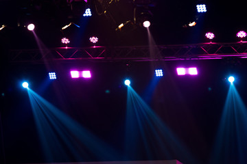 Performance moving lighting on construction light beam ray downward in yellow blue color, on Concert and Fashion Show stage ramp. LED par new technology to save power more color and high density Light