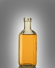 A bottle of strong alcohol in a transparent bottle