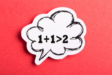 Synergy 1+1>2 Speech Bubble Isolated On Red Background