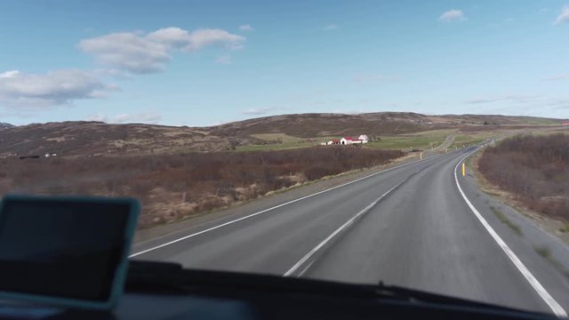 Driving on a road in Iceland with beautiful lanscape and many things to look at.