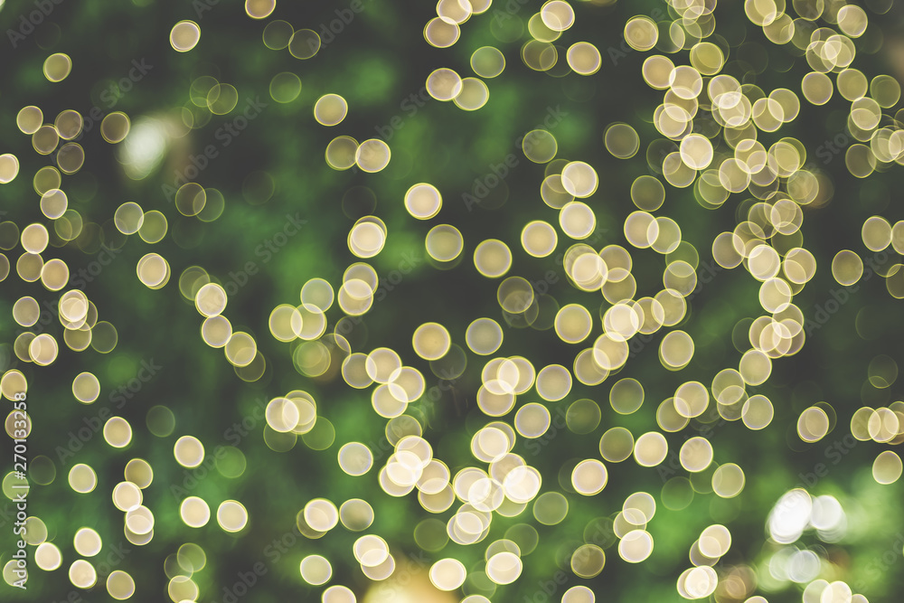 Poster Abstract blur decoration ball and light string on christmas tree with bokeh light background.winter holiday seasonal.