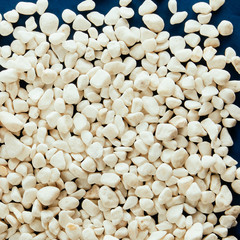 White stones and pebbles on blue background