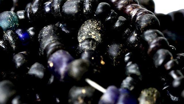 Close up of Ancient rare black Tradewind glass