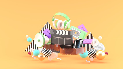 Filmstrip and clapper movies and entertainment on orange blackground.-3d rendering.