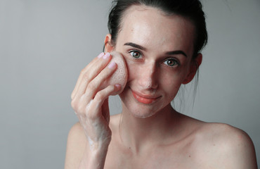 girl washing herself in the morning in the bathroom