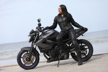 Fototapeta na wymiar young girl on a motorcycle