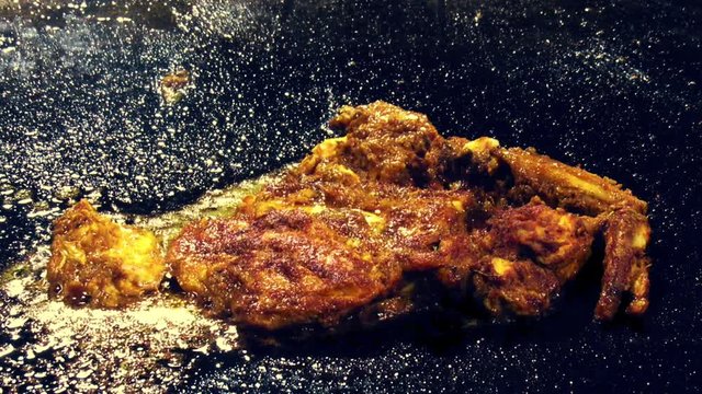 Famous Indian dish i.e. Tangdi. A fired chicken leg with spices in it.Fried on black colored large fryer. Served in the iftar also.